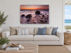 Silken Dusk Boulders coastal canvas print on the wall of a beach house living room