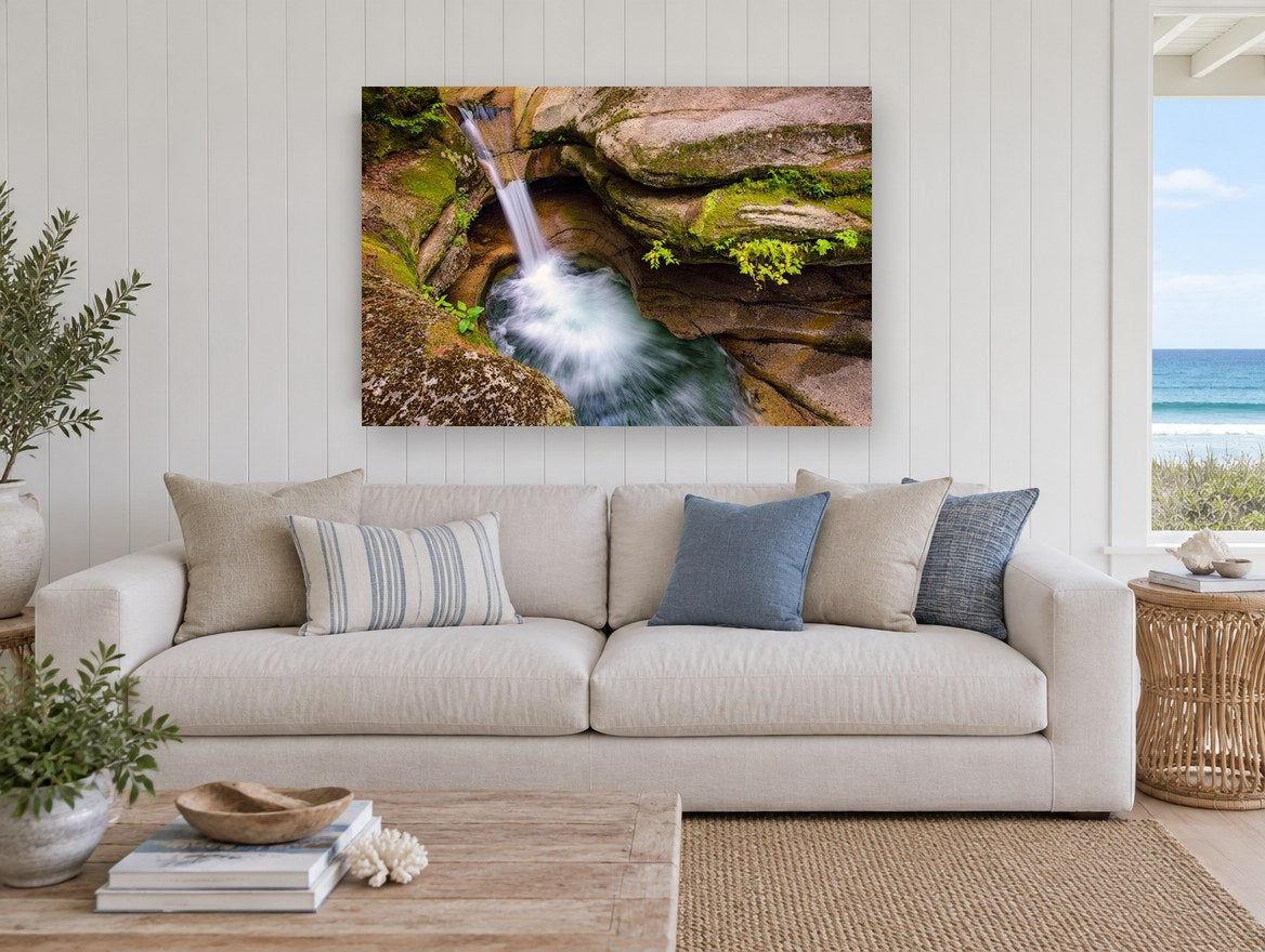 Mossy Rock Punchbowl landscape canvas print on the wall of a beach house living room