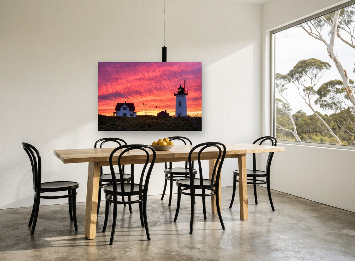 Lighthouse Sky Ablaze landscape canvas print on the wall of a dining room