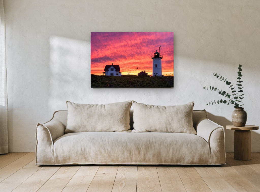 Lighthouse Sky Ablaze landscape canvas print on the wall of a living room