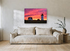 Lighthouse Sky Ablaze landscape canvas print on the wall of a living room