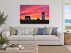 Lighthouse Sky Ablaze landscape canvas print on the wall of a beach house living room
