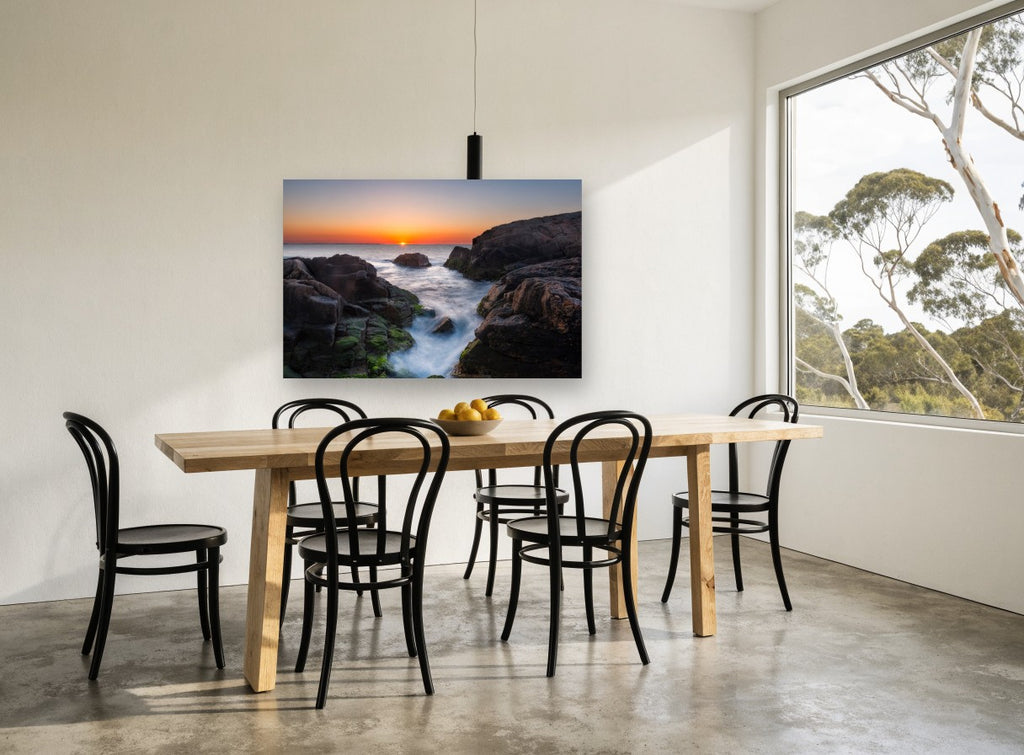 Sunrise Rock Channel coastal canvas print on the wall of a dining room