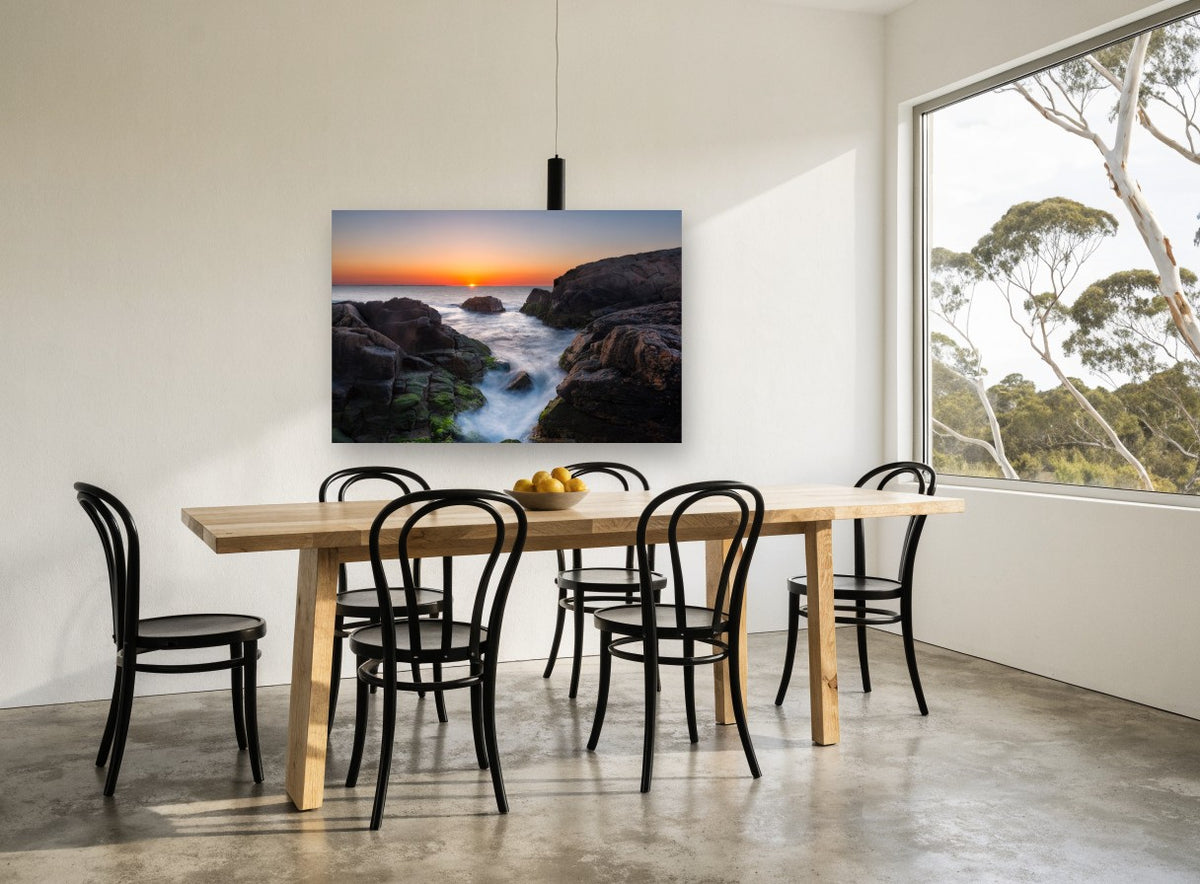 Sunrise Rock Channel coastal canvas print on the wall of a dining room
