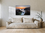 Sunrise Rock Channel coastal canvas print on the wall of a living room