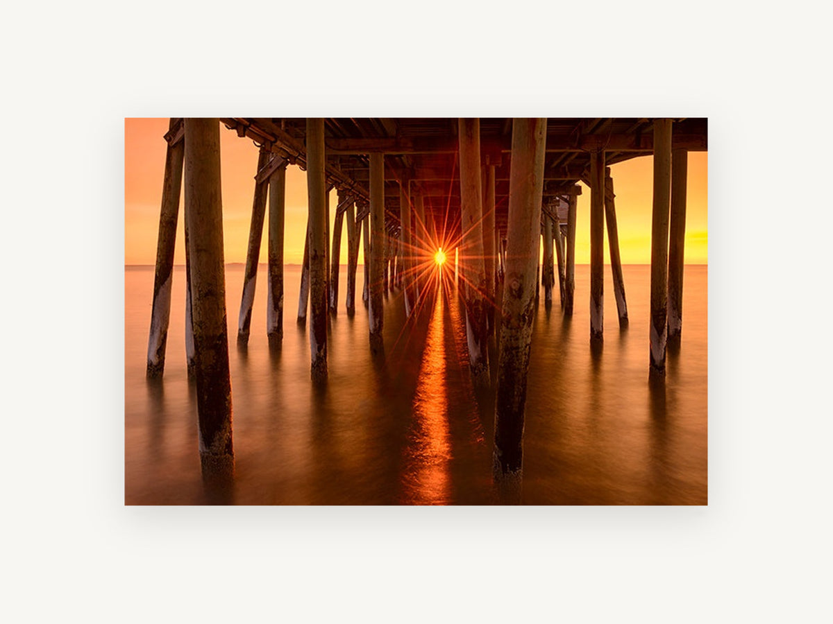 Sunburst Beneath the Pier, coastal canvas wall art print, front view