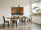 Winter Glow Bridge landscape canvas print on the wall of a dining room