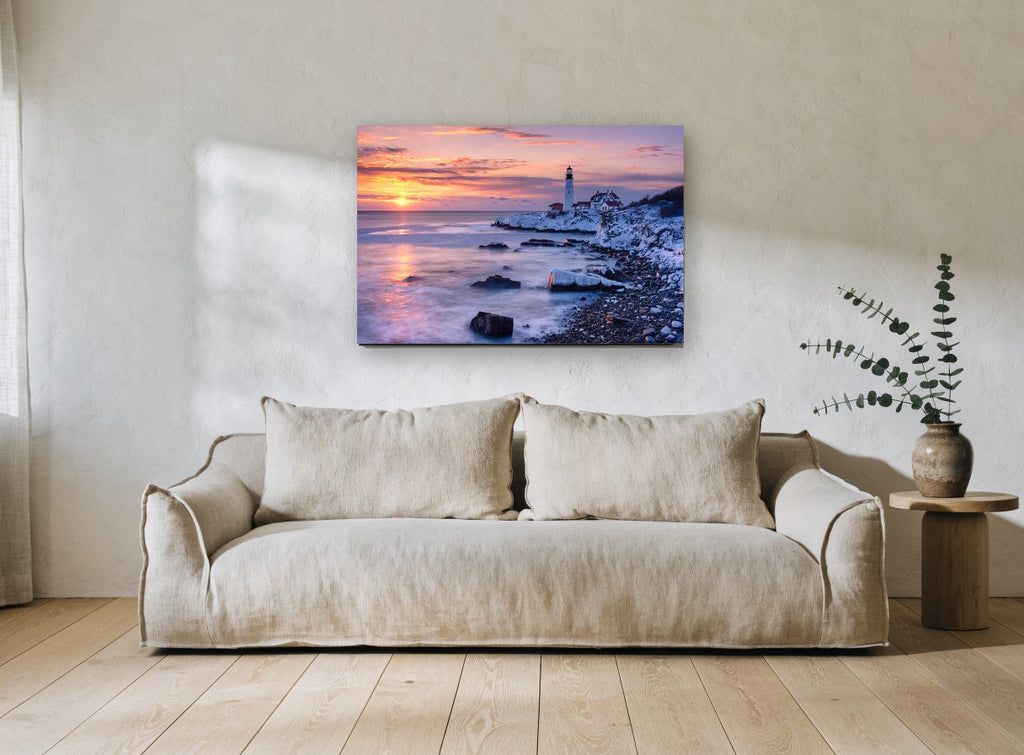 Winter Dawn Lighthouse coastal canvas print on the wall of a living room