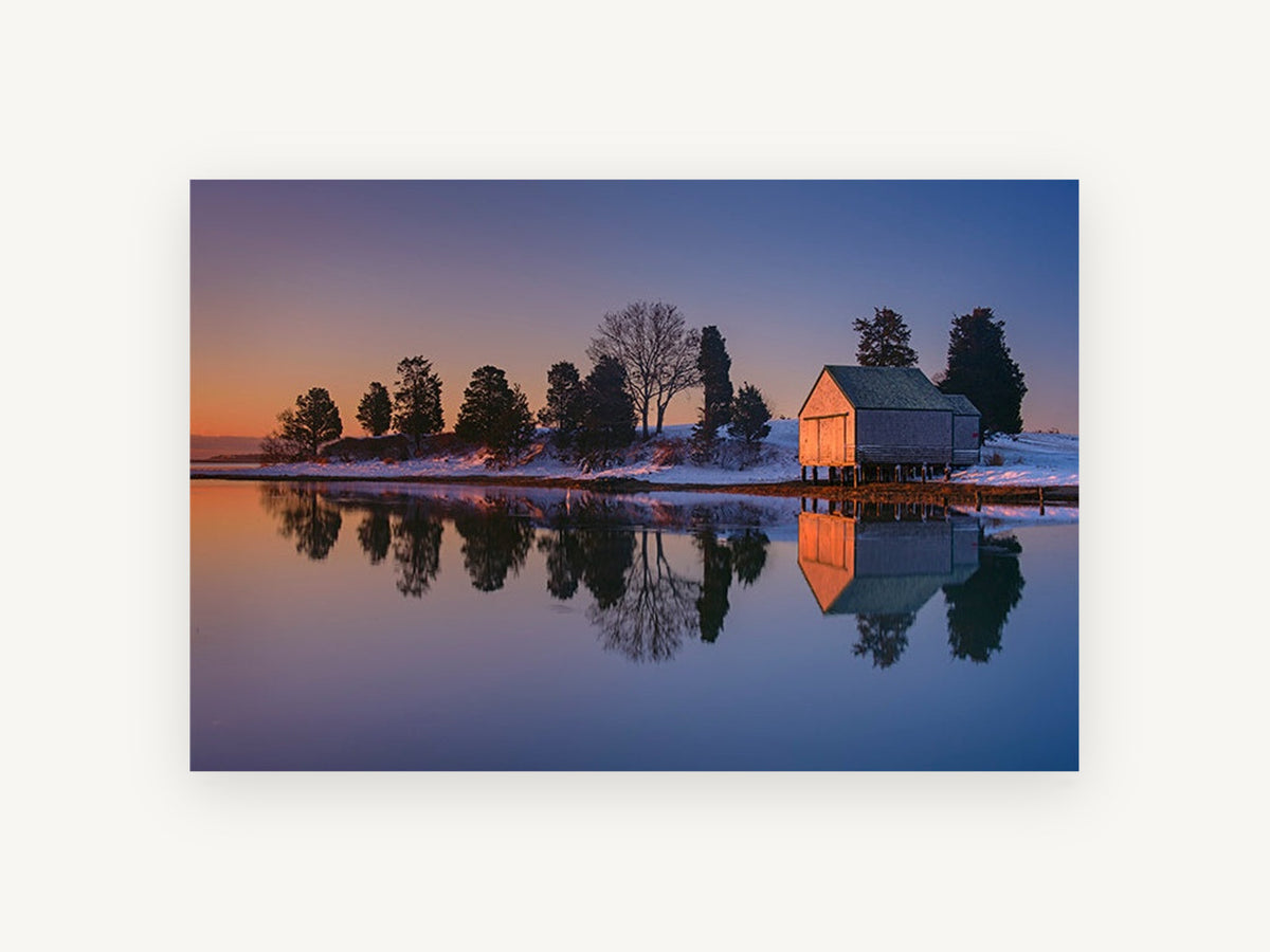 Dusk Boathouse Reflection, snowy boathouse lake reflection photograph, landscape canvas wall art print, front view