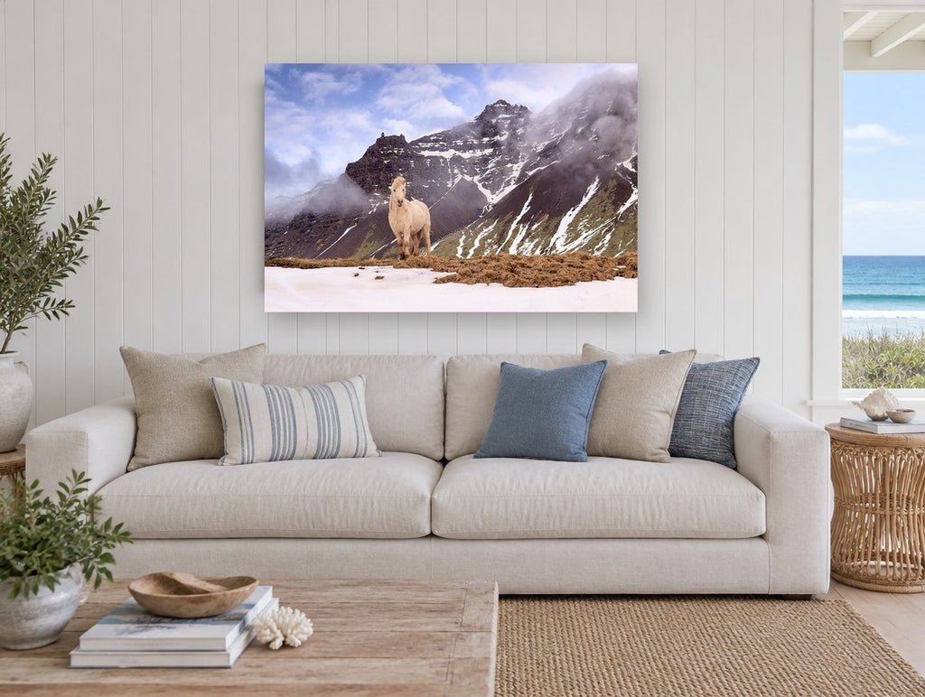 Pale Horse Snow Ridge landscape canvas print on the wall of a beach house living room