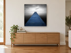 Blue Jetty Stillness coastal canvas print on the wall of a living room above a sideboard