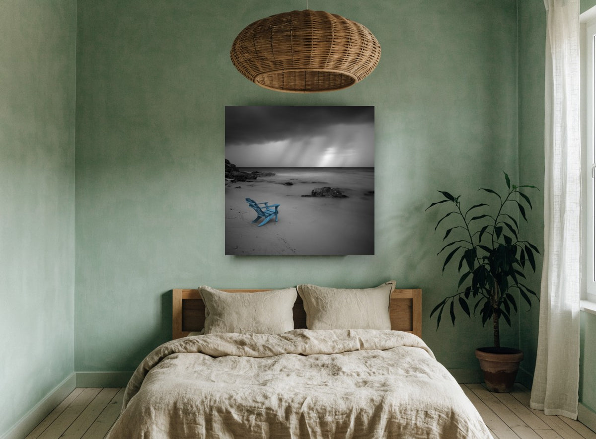 Blue Chair Storm Beach coastal canvas print on the wall of a bedroom