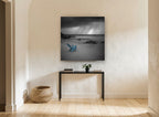 Blue Chair Storm Beach coastal canvas print on the wall of a hallway