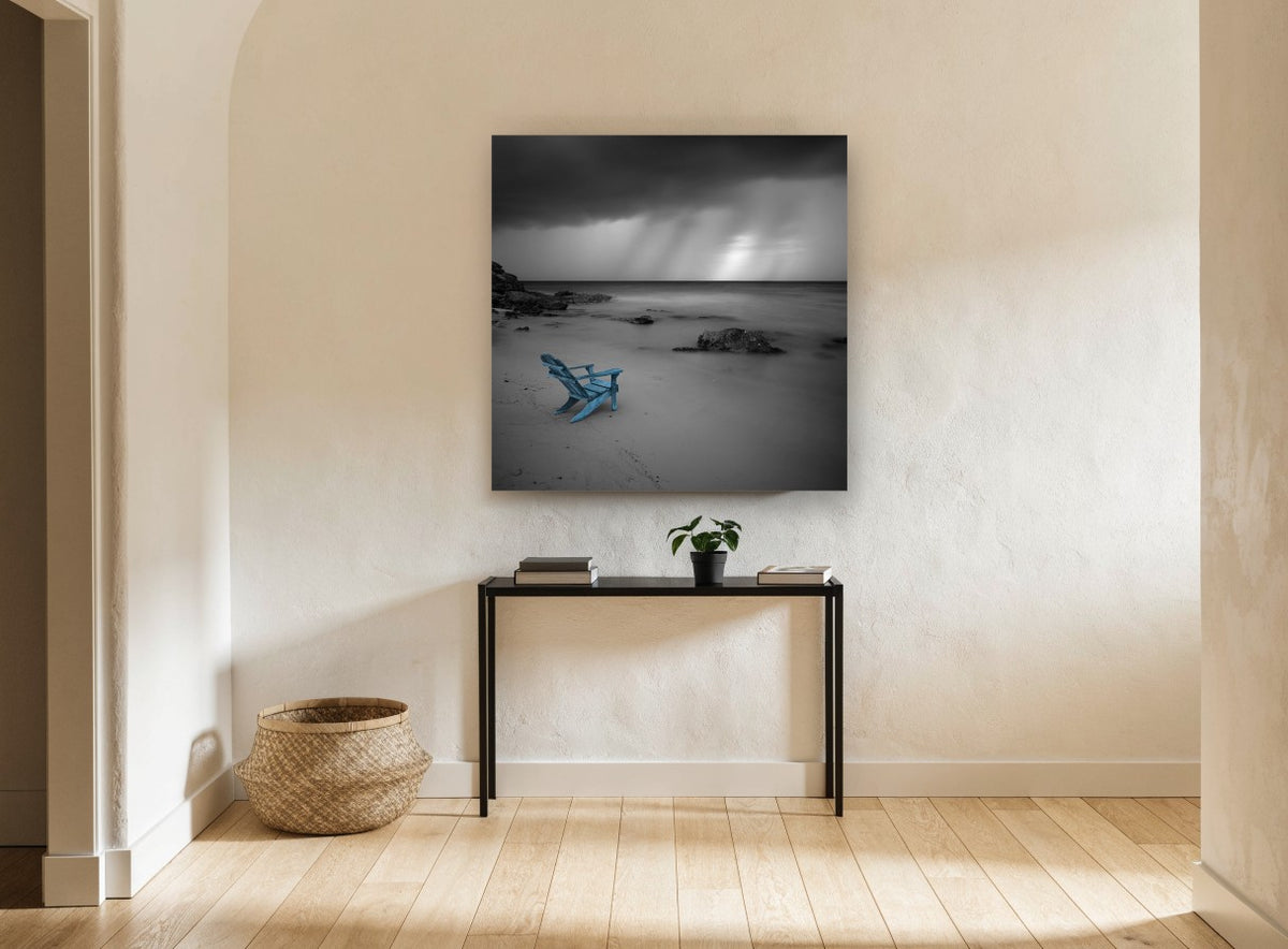 Blue Chair Storm Beach coastal canvas print on the wall of a hallway