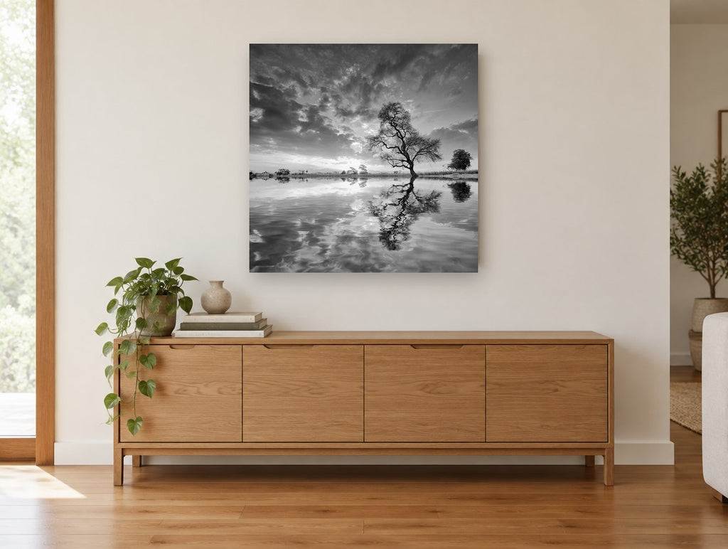 Lone Tree Mirrored landscape canvas print on the wall of a living room above a sideboard