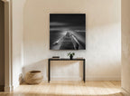 Silent Jetty Noir coastal canvas print on the wall of a hallway