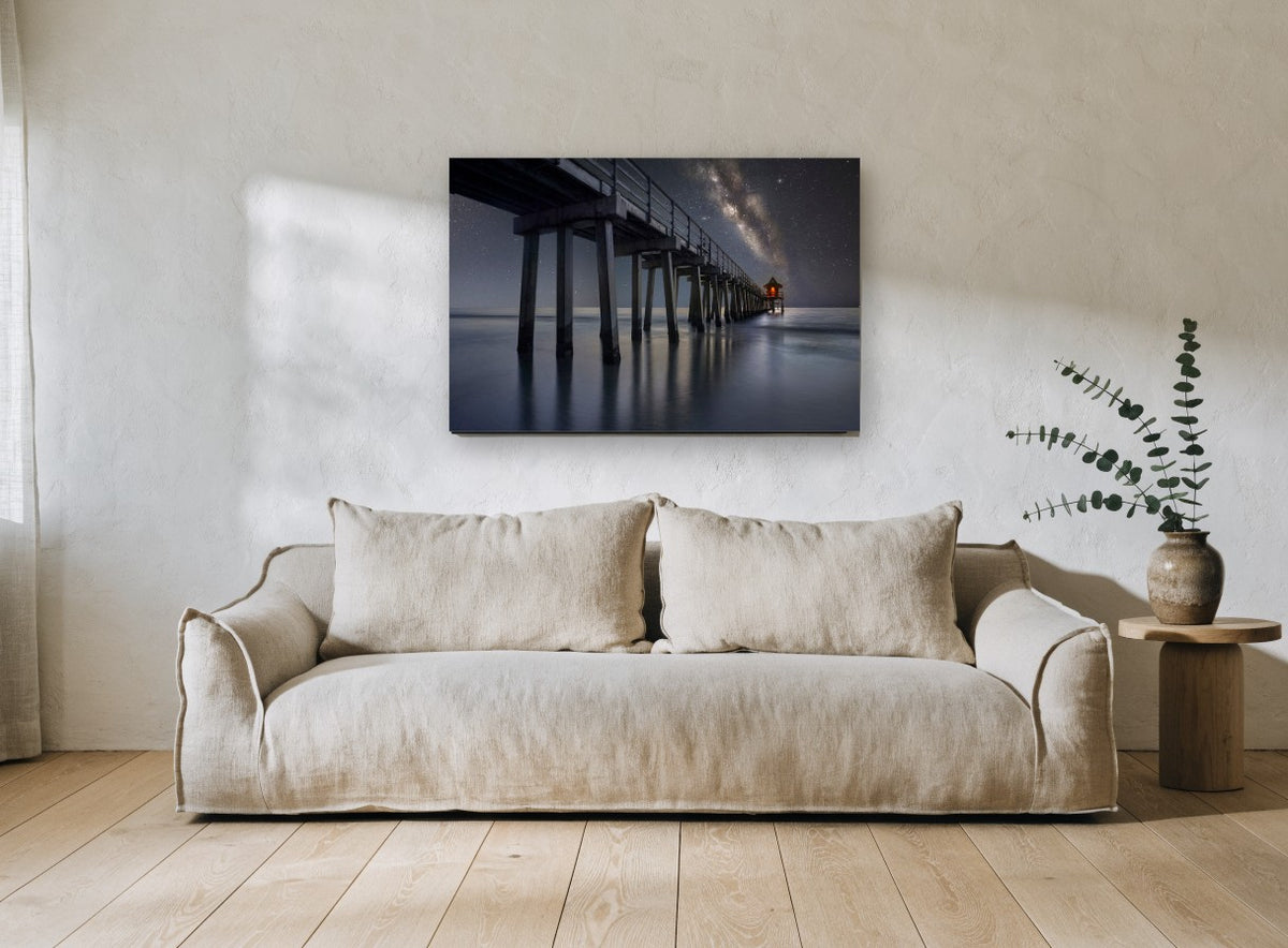 Pier Under the Milky Way landscape canvas print on the wall of a living room