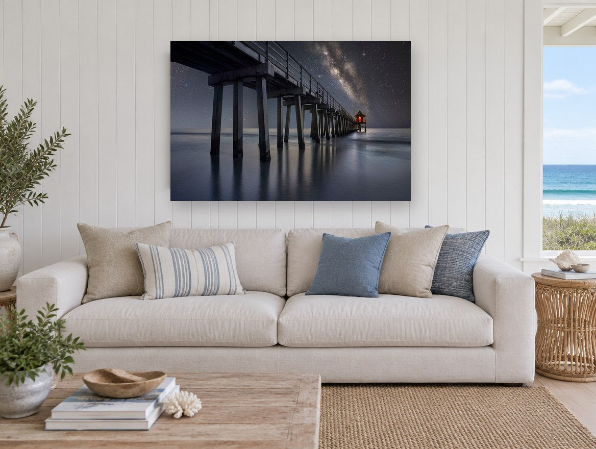 Pier Under the Milky Way landscape canvas print on the wall of a beach house living room