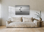 Leaning Tree Reflection coastal canvas print on the wall of a living room