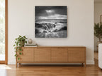 Churning Sea Basin landscape canvas print on the wall of a living room above a sideboard