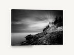 Beam Over the Rocks, lighthouse on rocky coast black and white, coastal canvas wall art print ready to hang