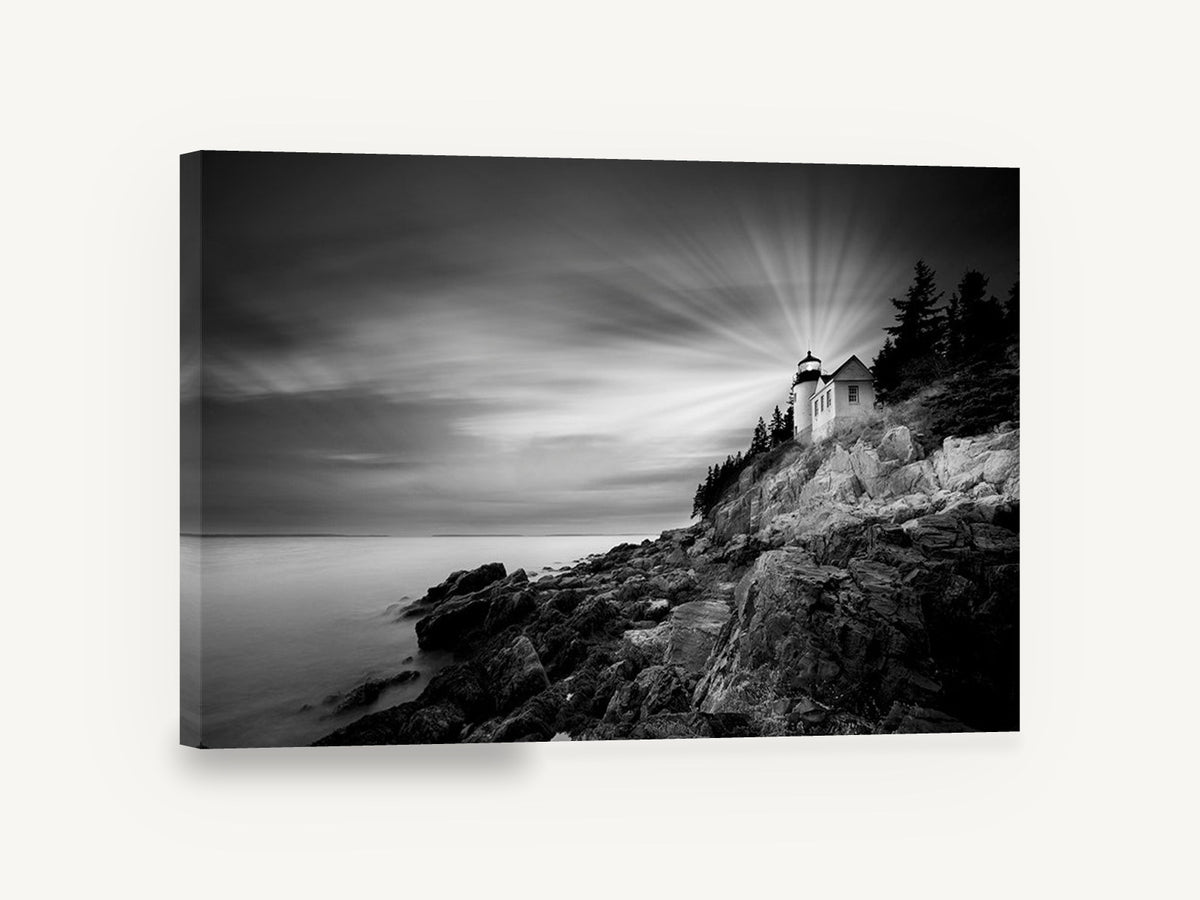 Beam Over the Rocks, lighthouse on rocky coast black and white, coastal canvas wall art print ready to hang