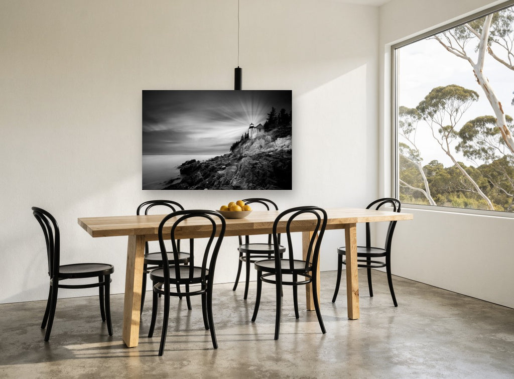Beam Over the Rocks coastal canvas print on the wall of a dining room