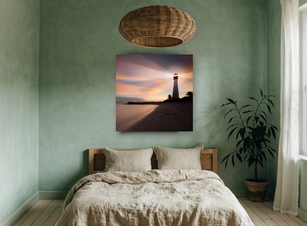 Lighthouse Dusk Glow coastal canvas print on the wall of a bedroom