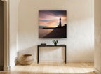 Lighthouse Dusk Glow coastal canvas print on the wall of a hallway