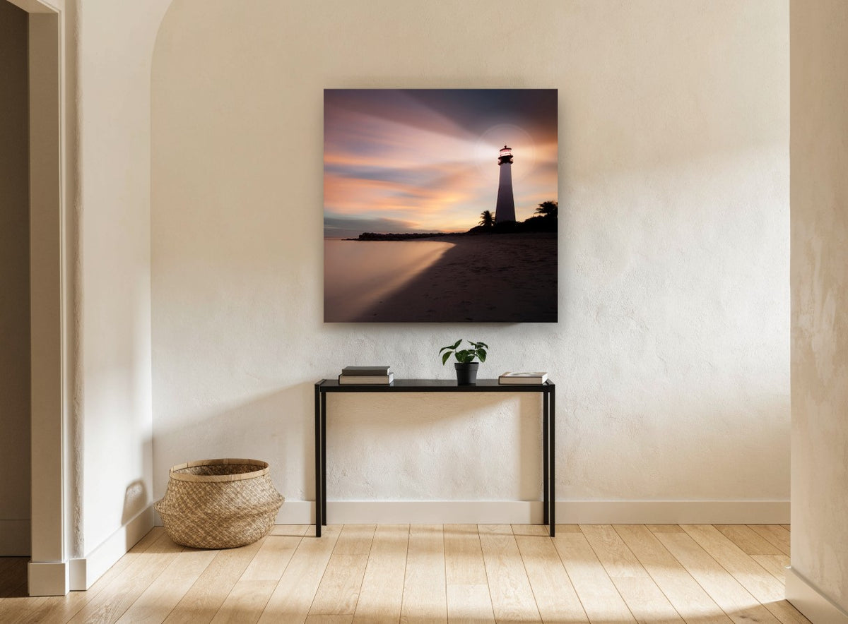 Lighthouse Dusk Glow coastal canvas print on the wall of a hallway