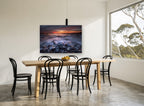 Dusk Surf Over Pebbles landscape canvas print on the wall of a dining room
