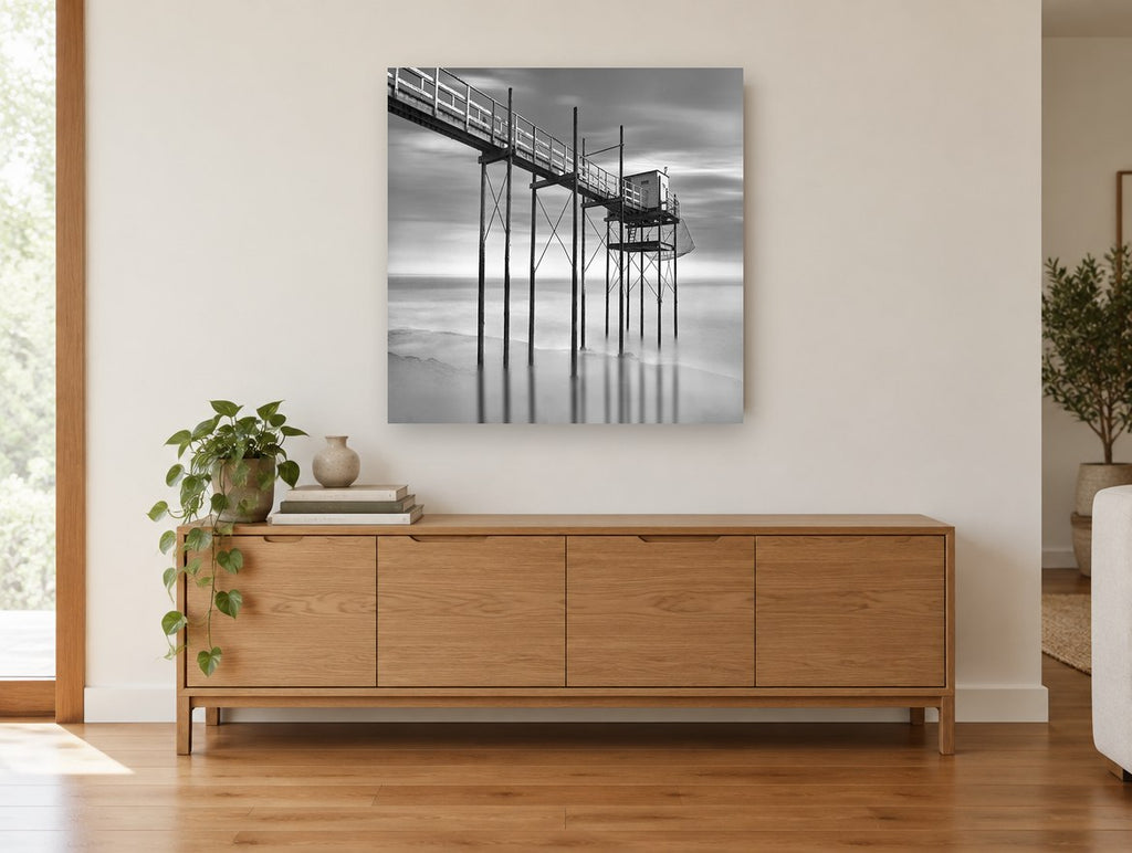 Stilted Fishing Hut coastal canvas print on the wall of a living room above a sideboard