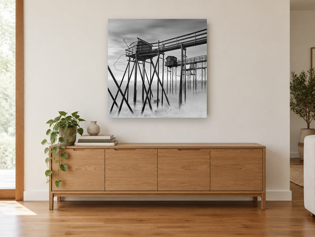 Stilted Fishing Huts coastal canvas print on the wall of a living room above a sideboard