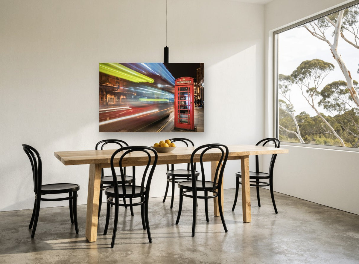 Red Box Night Blur city canvas print on the wall of a dining room