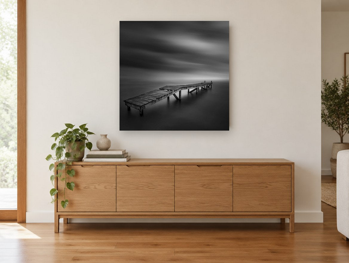 Crooked Jetty Calm coastal canvas print on the wall of a living room above a sideboard