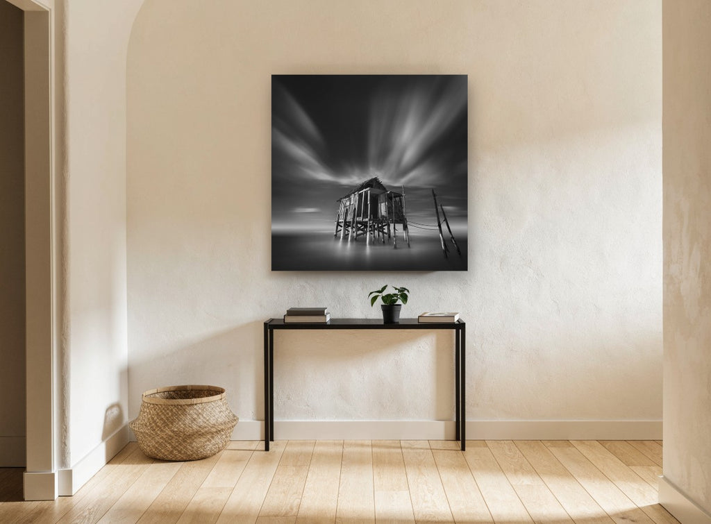 Stilted Shack Stillness coastal canvas print on the wall of a hallway