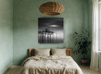 Blue Fishing Hut Stilts coastal canvas print on the wall of a bedroom