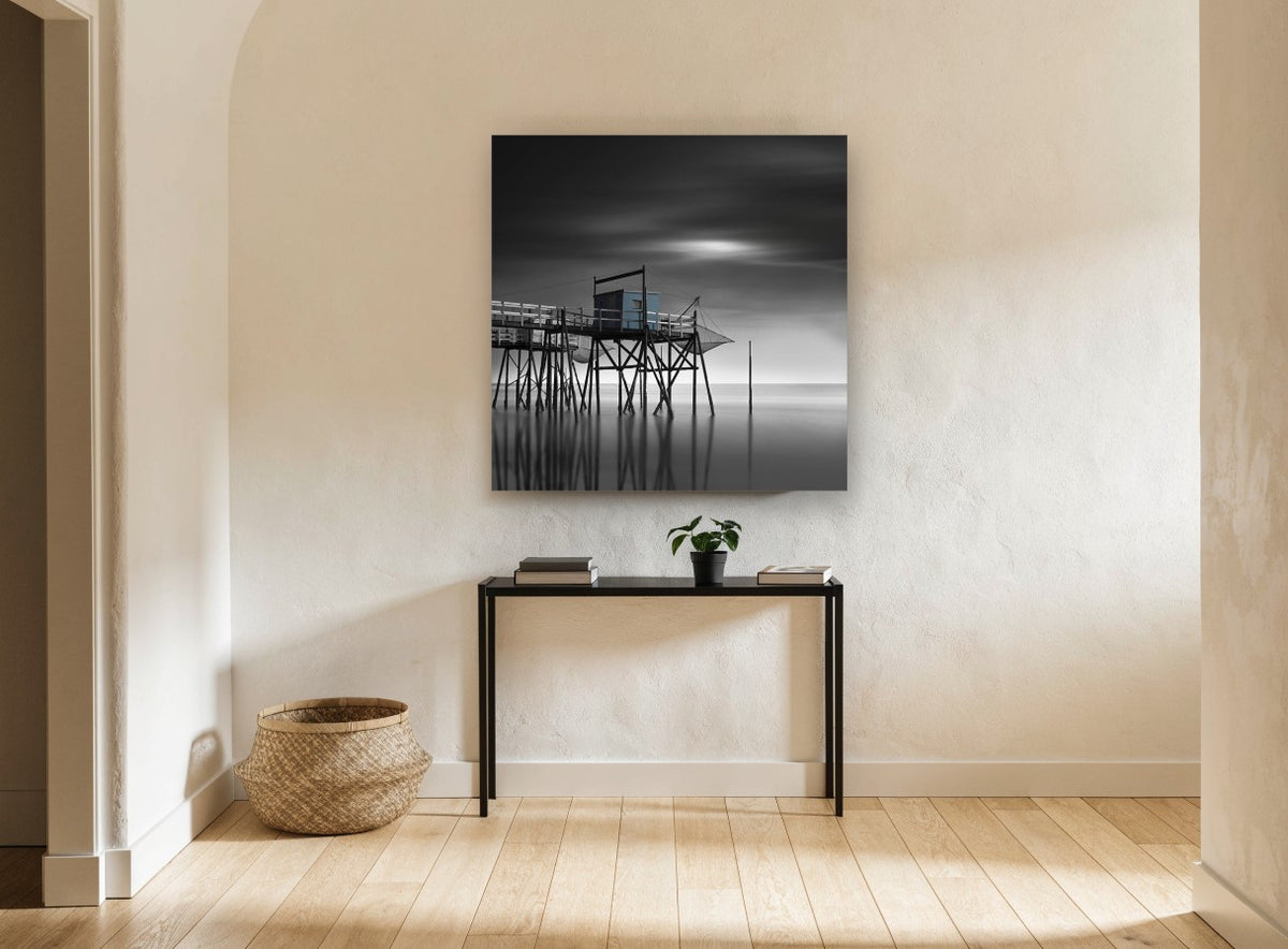 Blue Fishing Hut Stilts coastal canvas print on the wall of a hallway