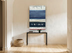 Sand and Surf Stripes coastal canvas print on the wall of a hallway