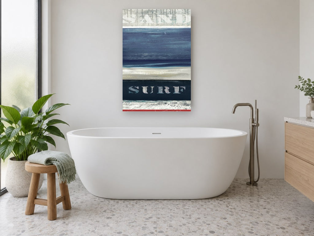 Sand and Surf Stripes coastal canvas print on the wall of a bathroom