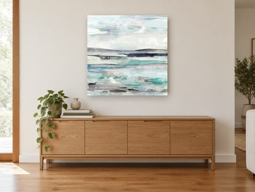 Pale Tide Layers coastal canvas print on the wall of a living room above a sideboard