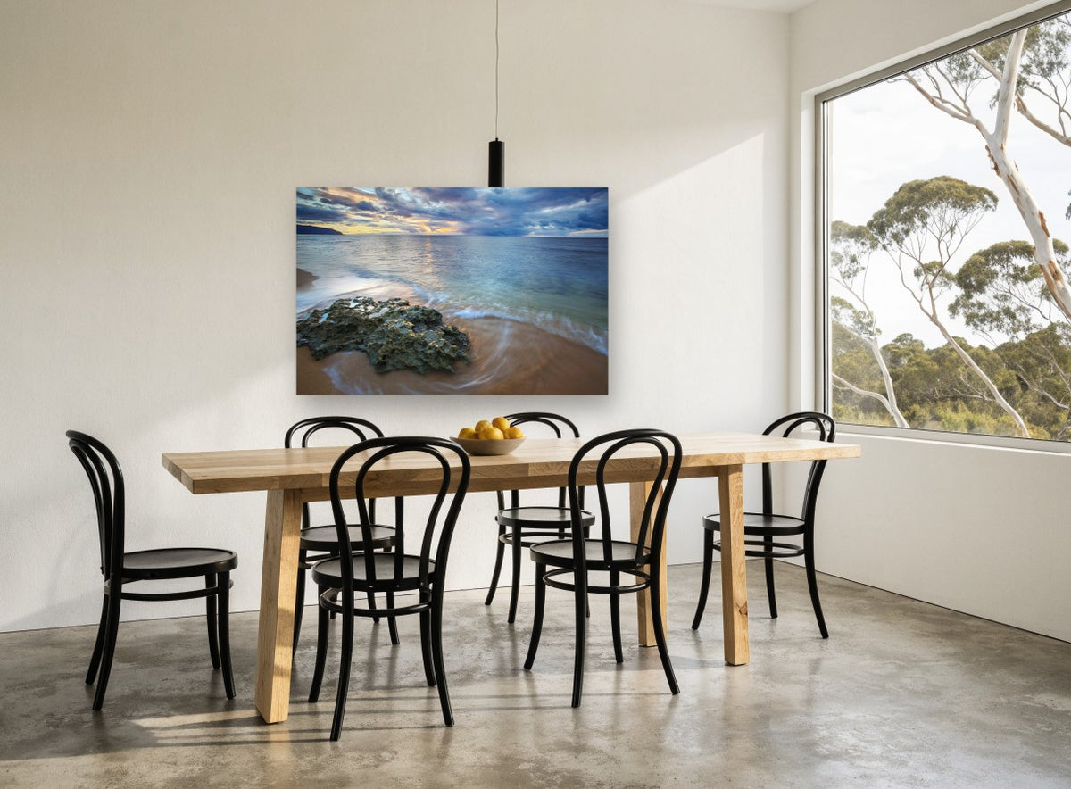 Rock at Dusk Shore landscape canvas print on the wall of a dining room