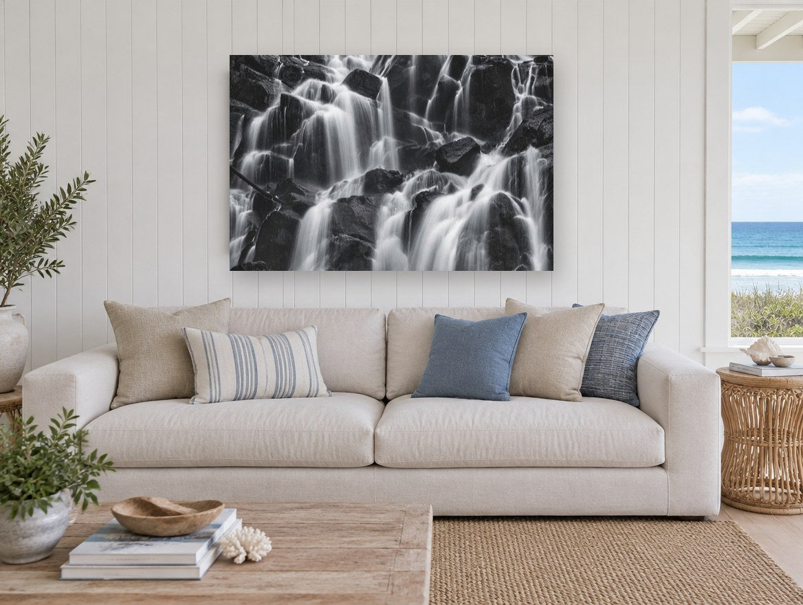 Silken Cascade Rocks landscape canvas print on the wall of a beach house living room