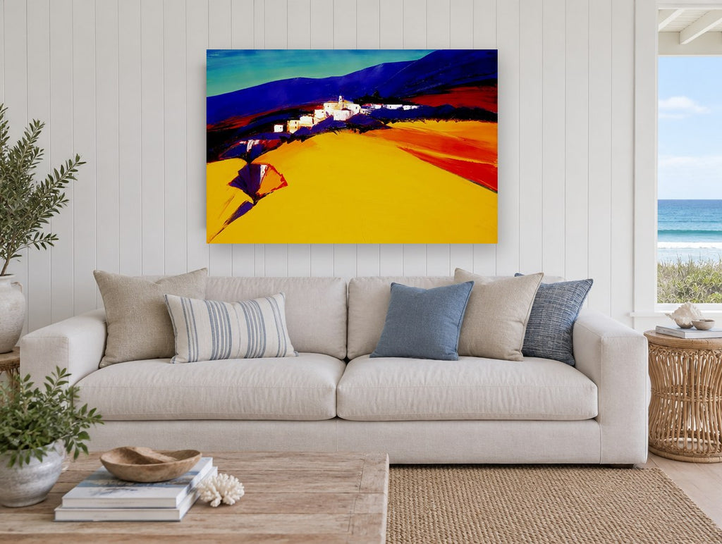Golden Hillside Village landscape canvas print on the wall of a beach house living room