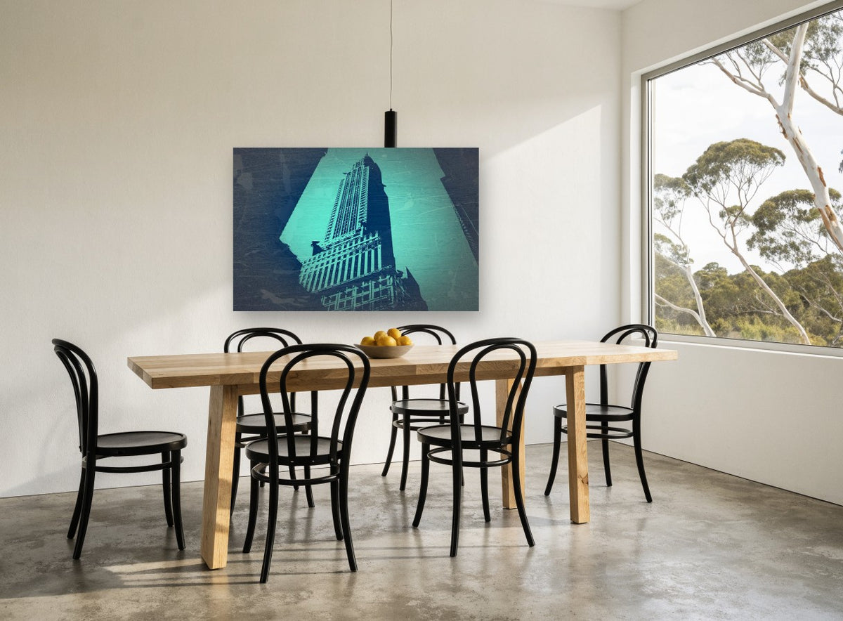 Teal Chrysler Spire city canvas print on the wall of a dining room