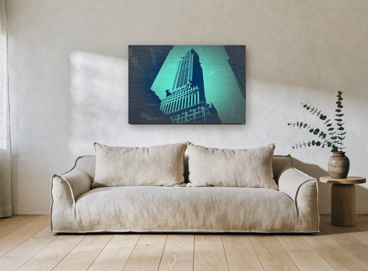 Teal Chrysler Spire city canvas print on the wall of a living room