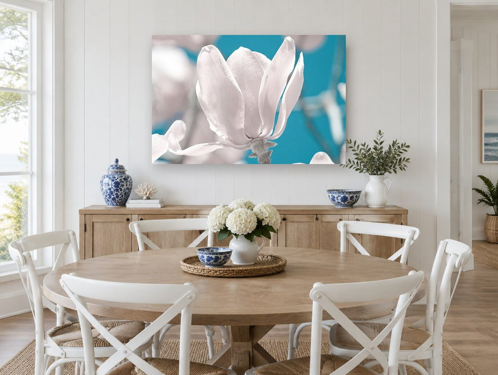 White Magnolia Against Teal floral canvas print on the wall of a Hamptons dining room