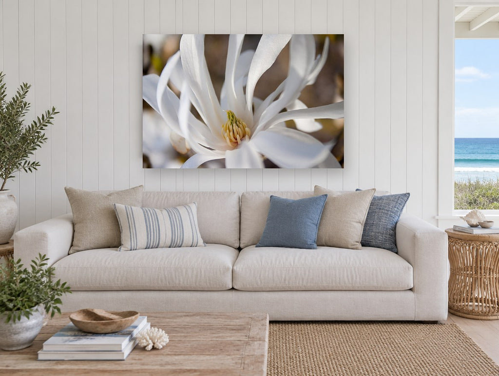 White Star Magnolia floral canvas print on the wall of a beach house living room