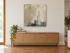 Gilded Chrysler Haze city canvas print on the wall of a living room above a sideboard