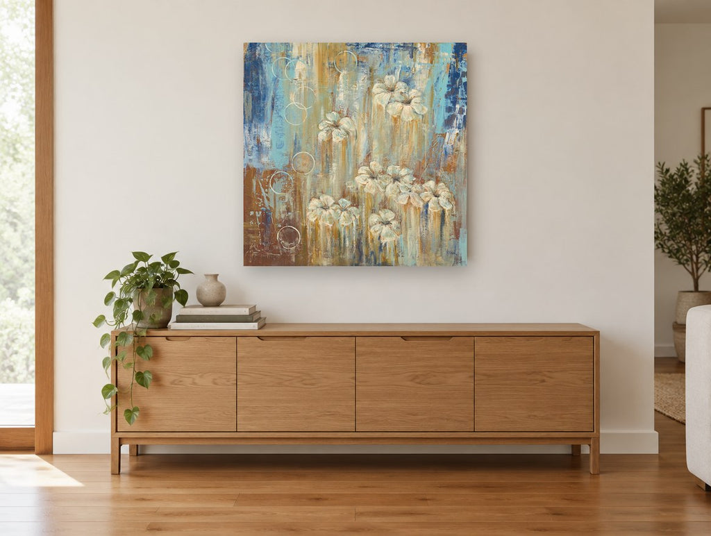 Cream Blooms in Rain floral canvas print on the wall of a living room above a sideboard